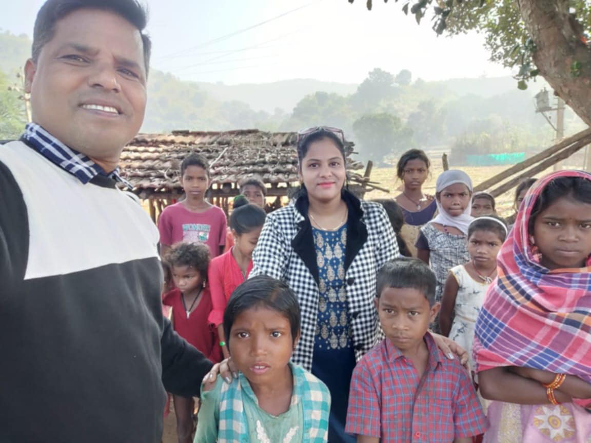 Pastor Tejoban Lima and wife Rashmita with some of the children they teach and provide food support